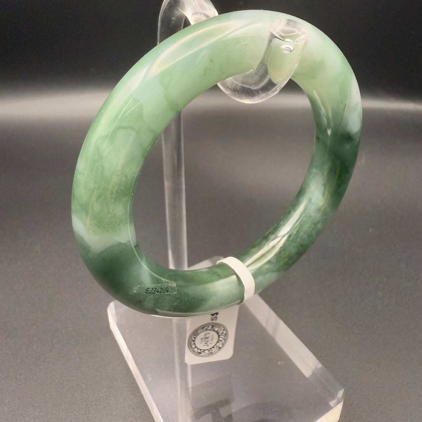 41. Dark green base with white patches jade bangle