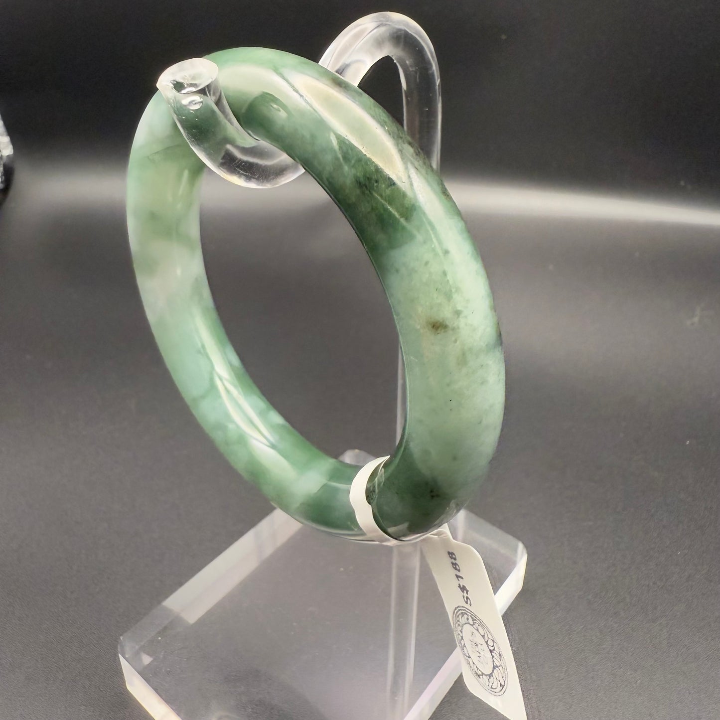 41. Dark green base with white patches jade bangle