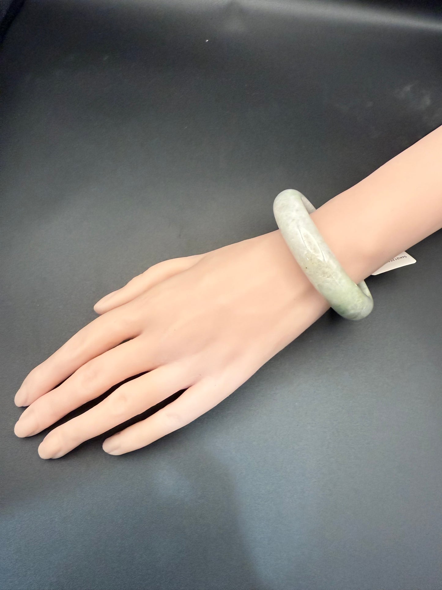 49. Grey with dashes of green jade bangle