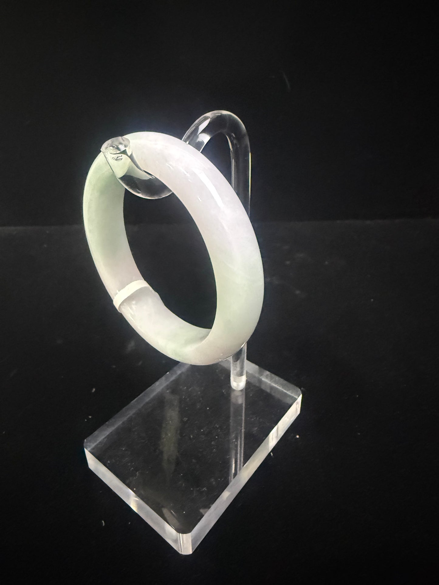 54. A fair green & purple jade bangle