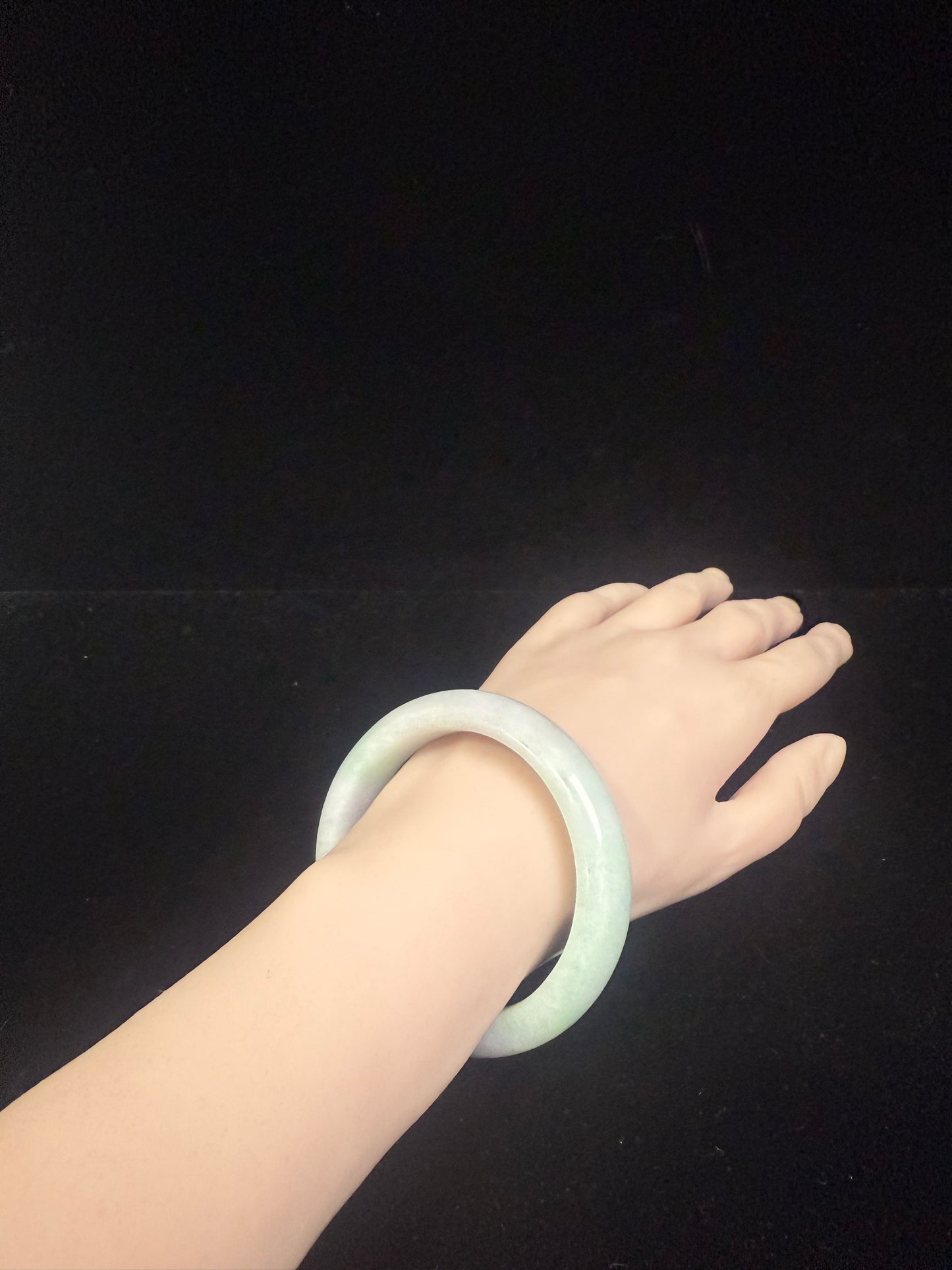 54. A fair green & purple jade bangle