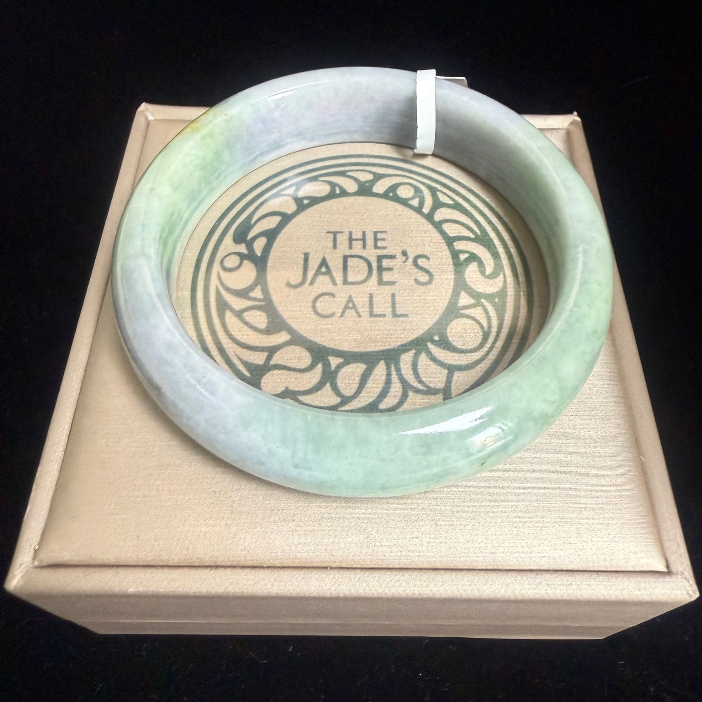67. Green, purple with a dash of yellow Jade bangle