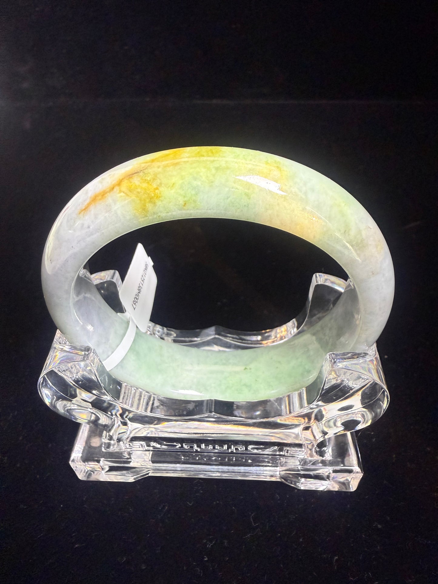 67. Green, purple with a dash of yellow Jade bangle