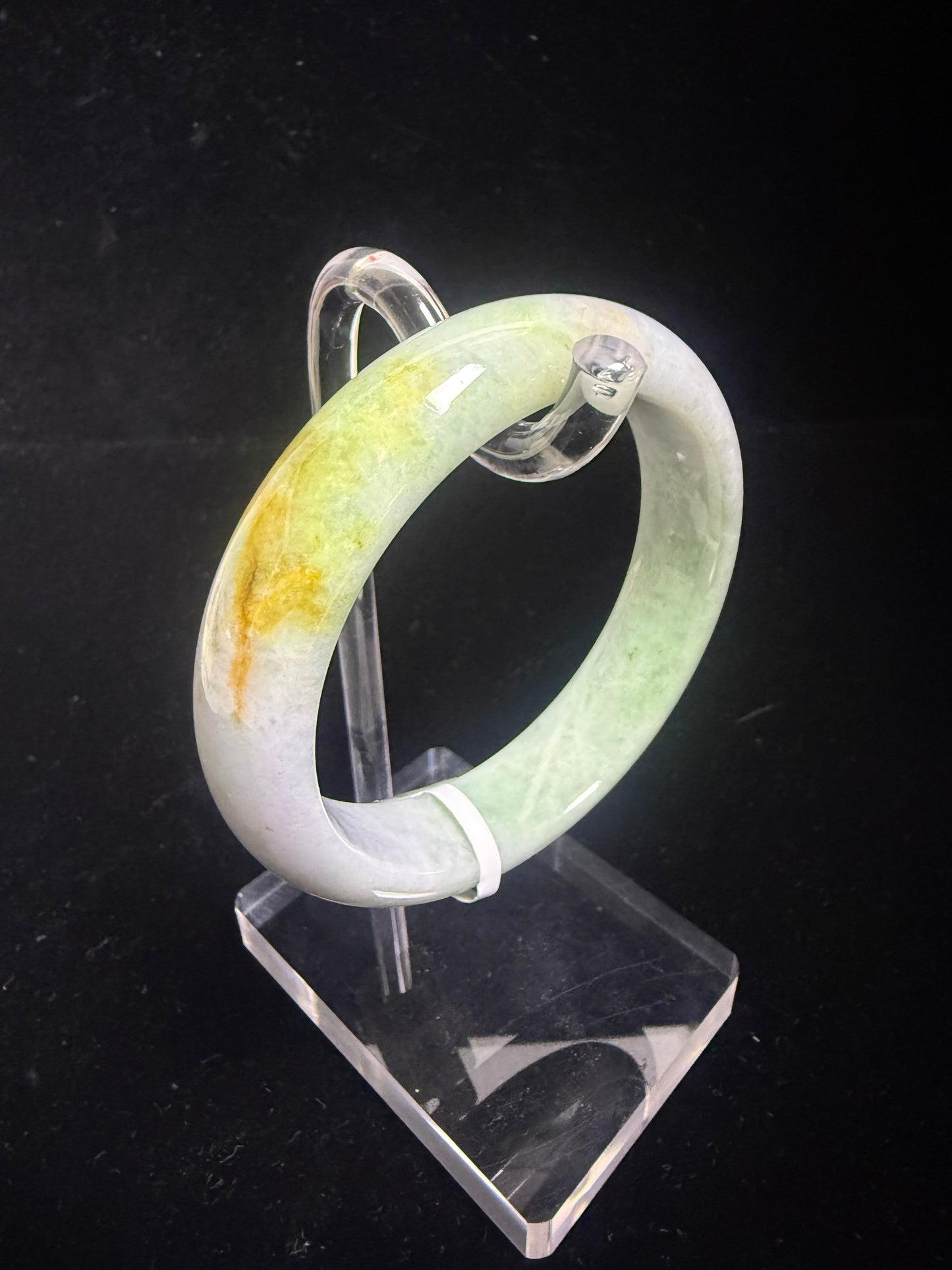 67. Green, purple with a dash of yellow Jade bangle