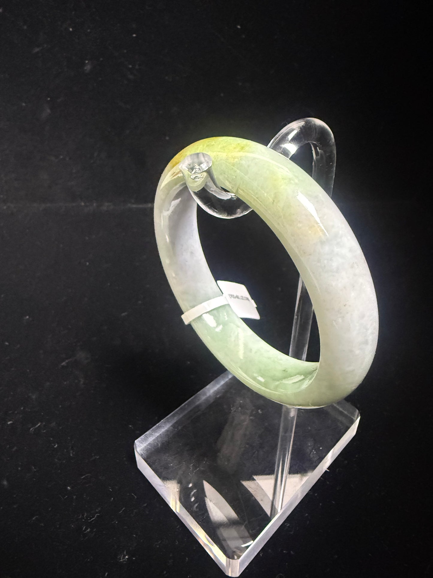 67. Green, purple with a dash of yellow Jade bangle