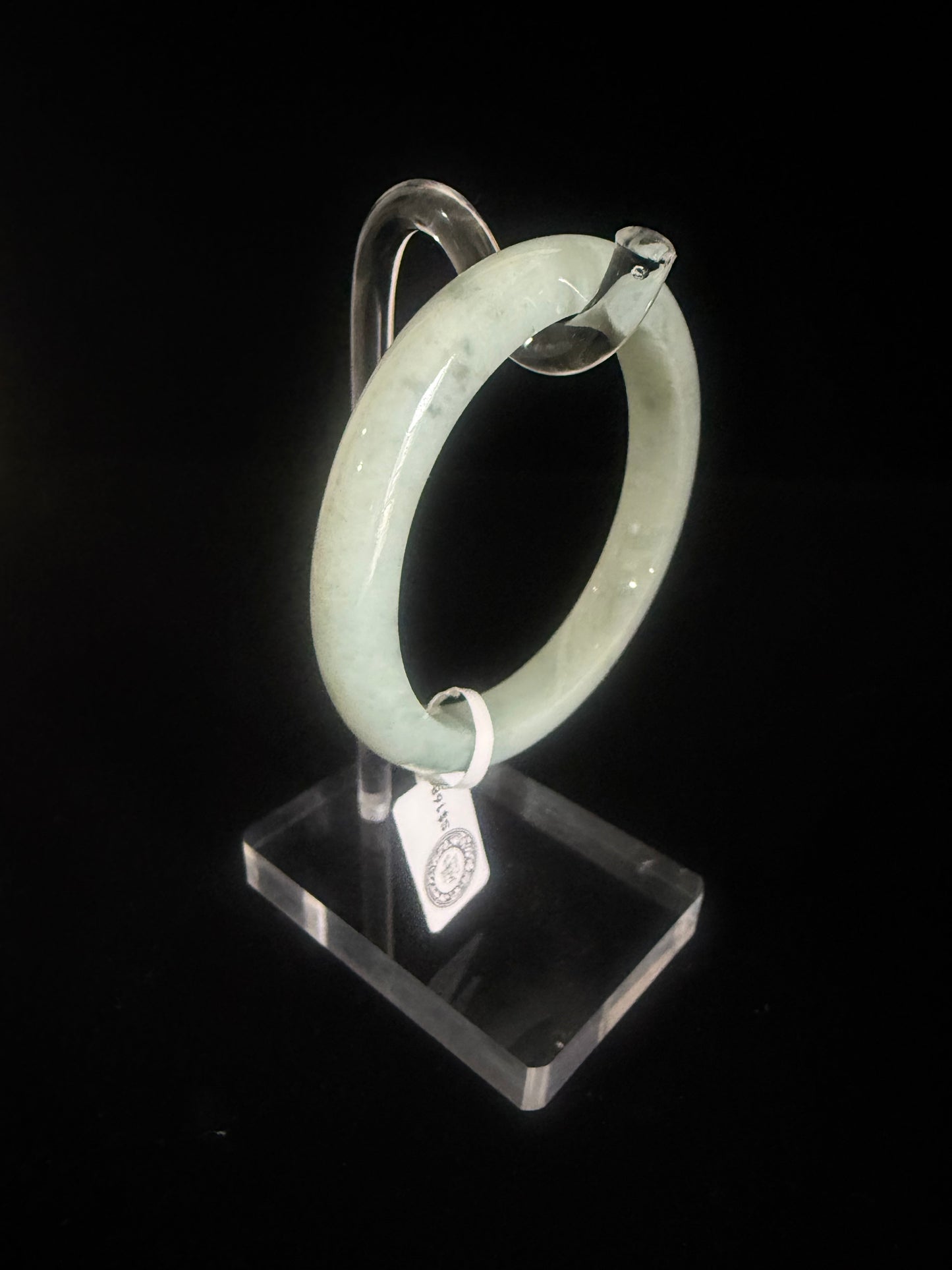 74. Light green with speckle of dark green jade bangle