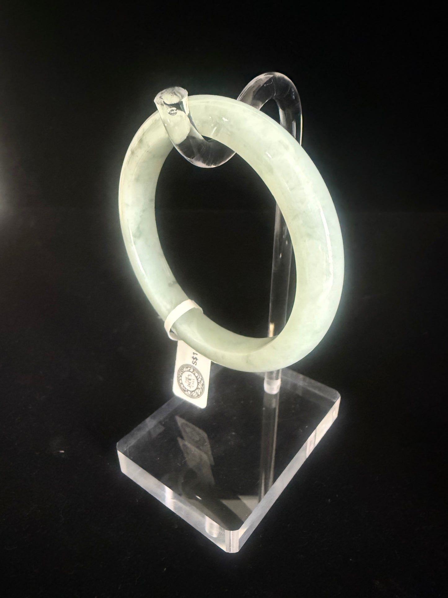 74. Light green with speckle of dark green jade bangle
