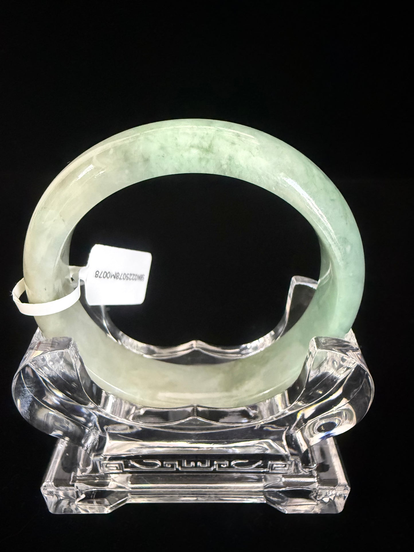 78. Intriguing Jade bangle 2 tones of green in half.