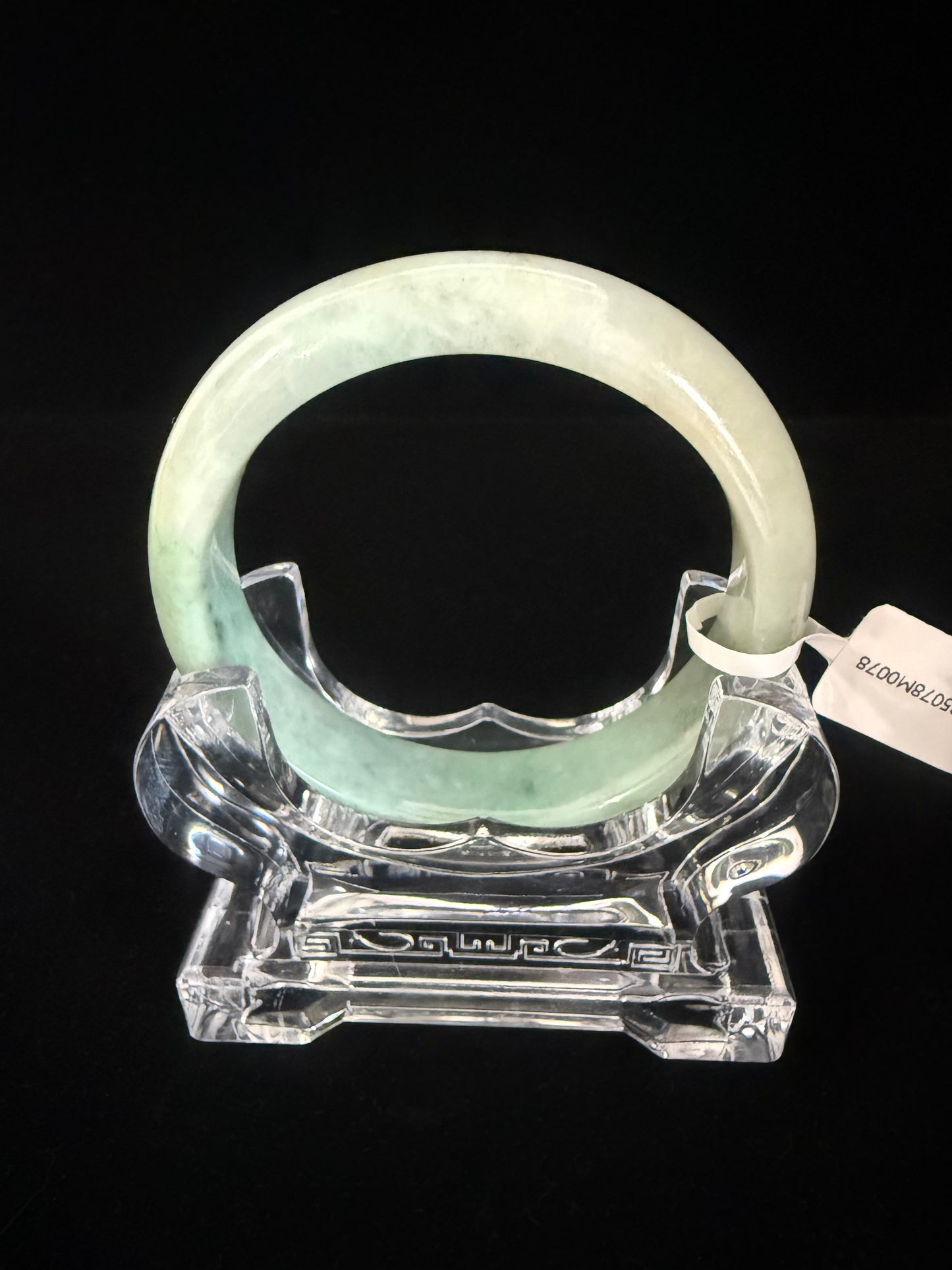 78. Intriguing Jade bangle 2 tones of green in half.