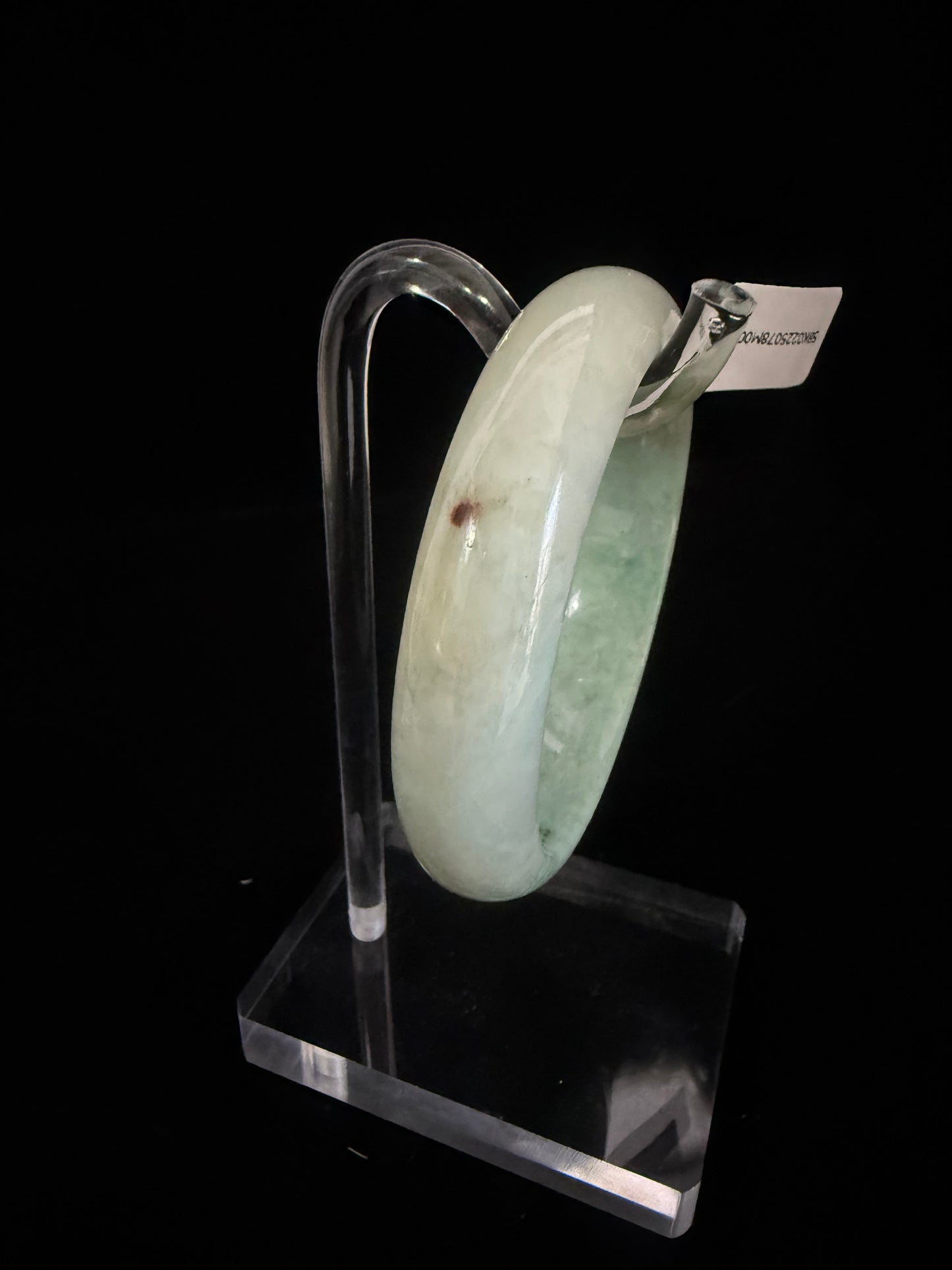 78. Intriguing Jade bangle 2 tones of green in half.