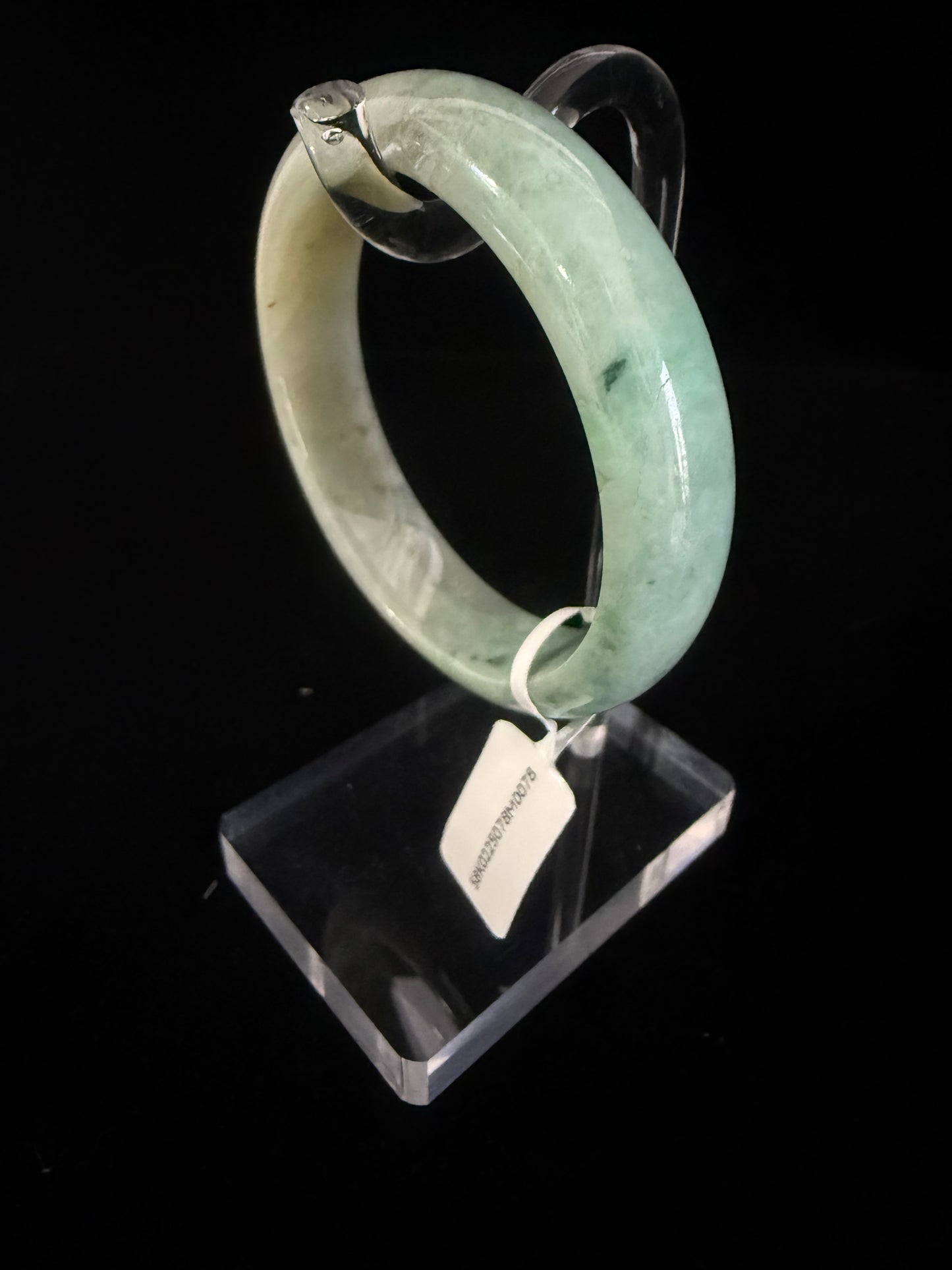 78. Intriguing Jade bangle 2 tones of green in half.
