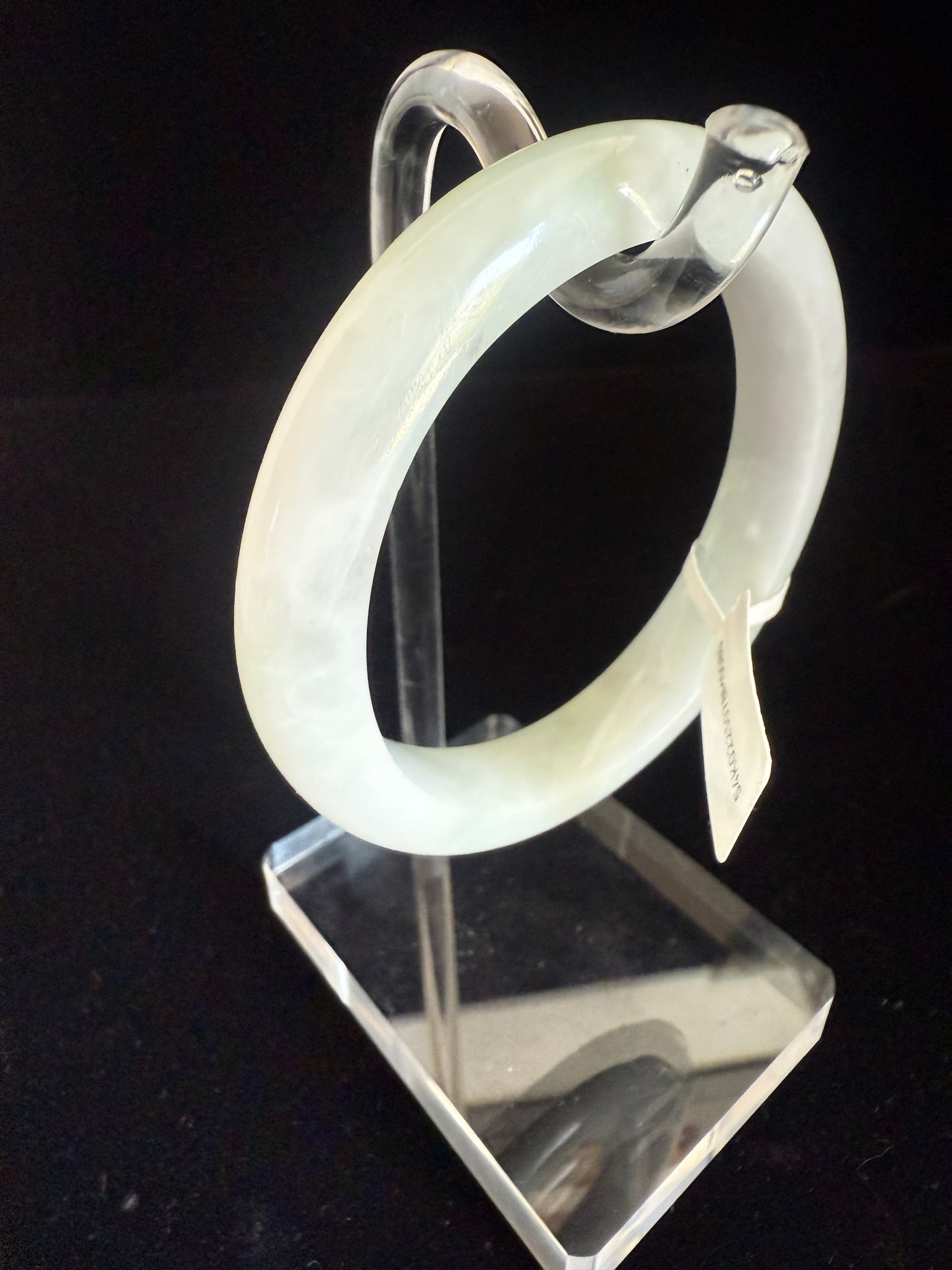 80. White with hue of green tone Jade bangle