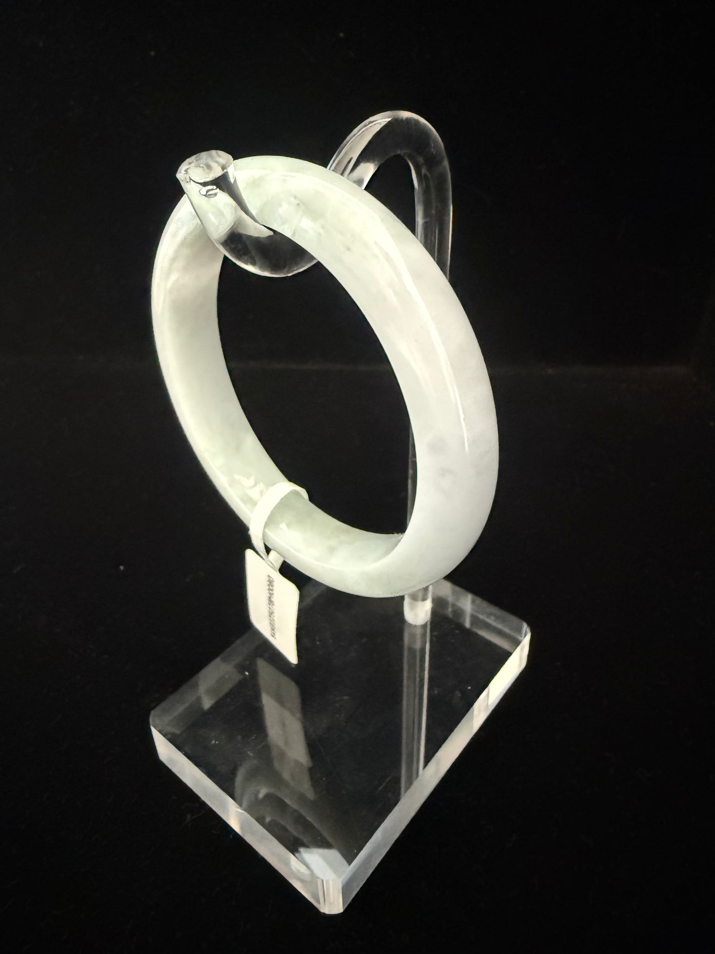 80. White with hue of green tone Jade bangle