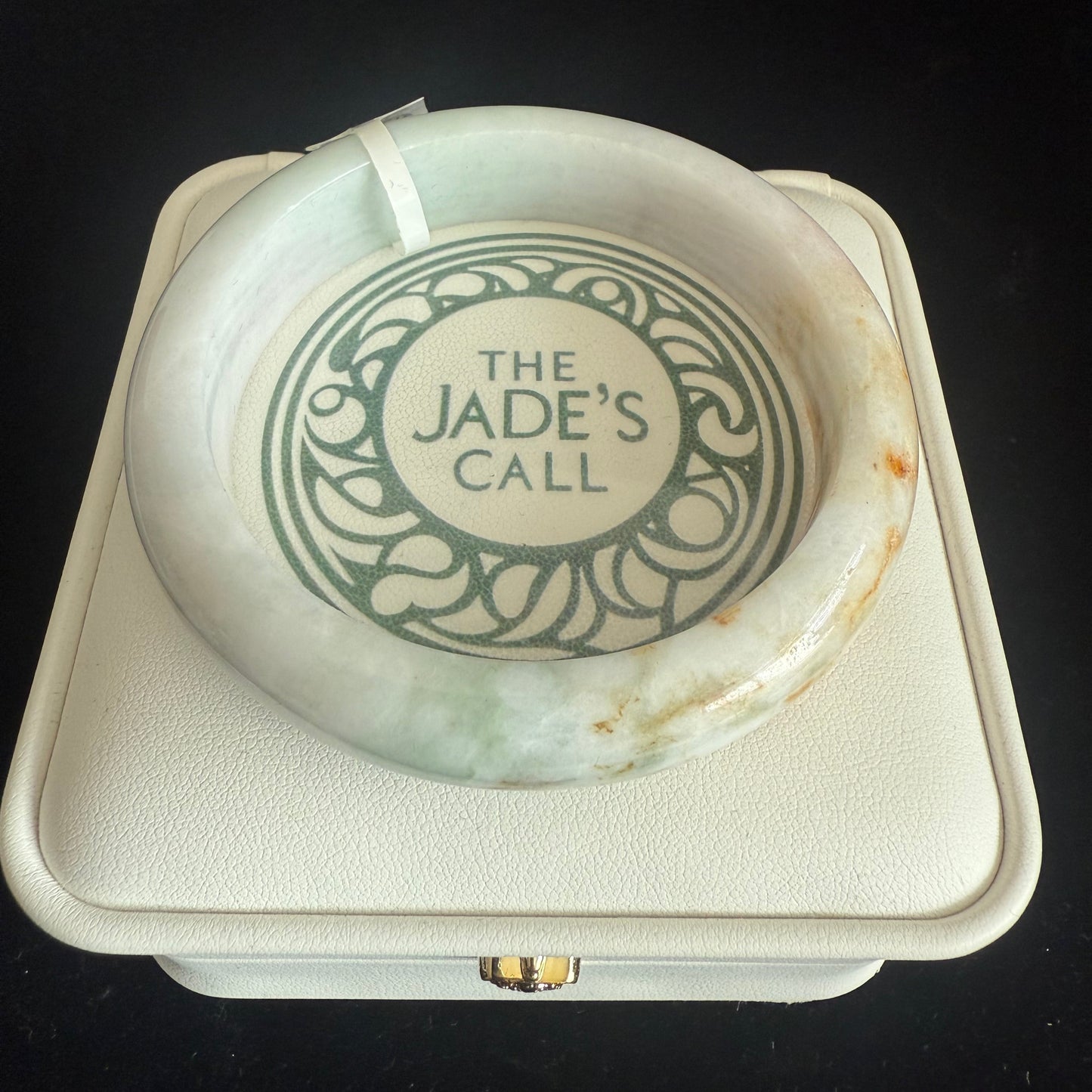 98. Brown, orange touches on white green jade bangle