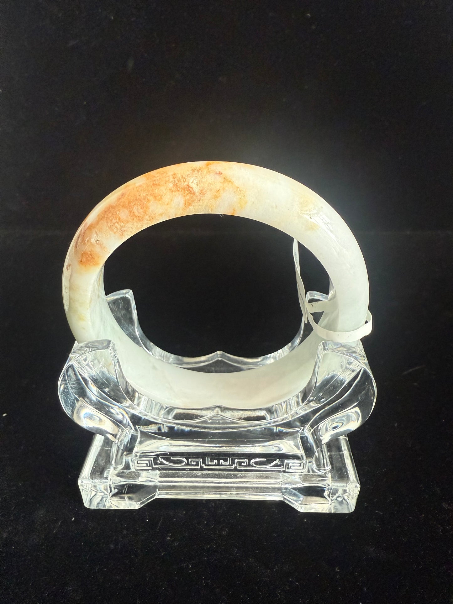 98. Brown, orange touches on white green jade bangle