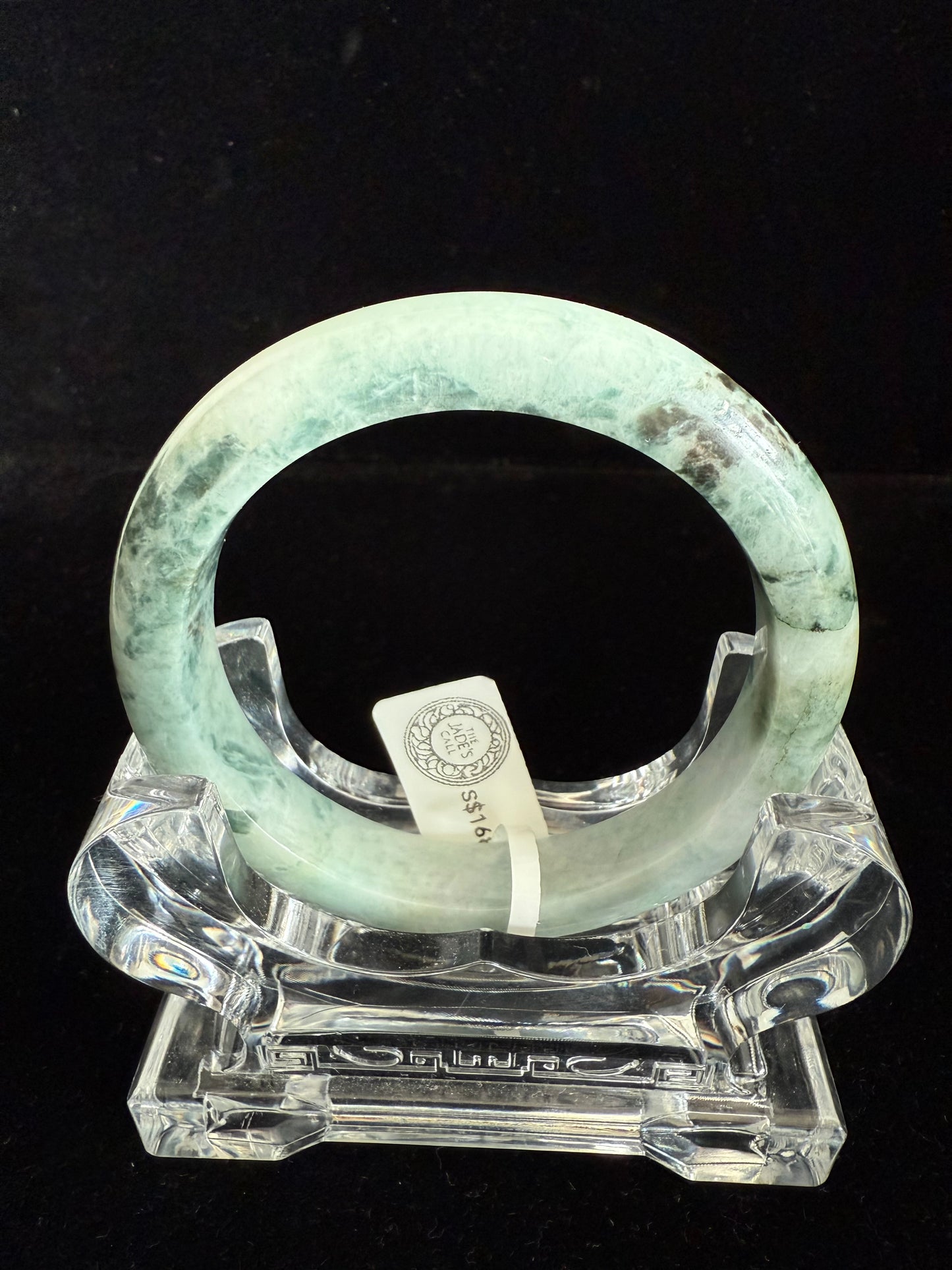99. Light green with dark brown pattern Jade Bangle.