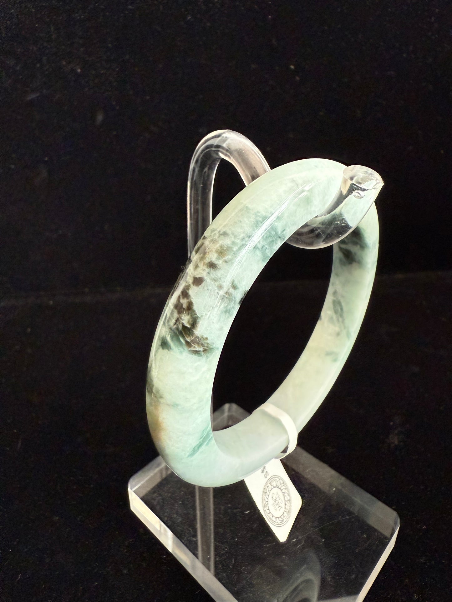 99. Light green with dark brown pattern Jade Bangle.