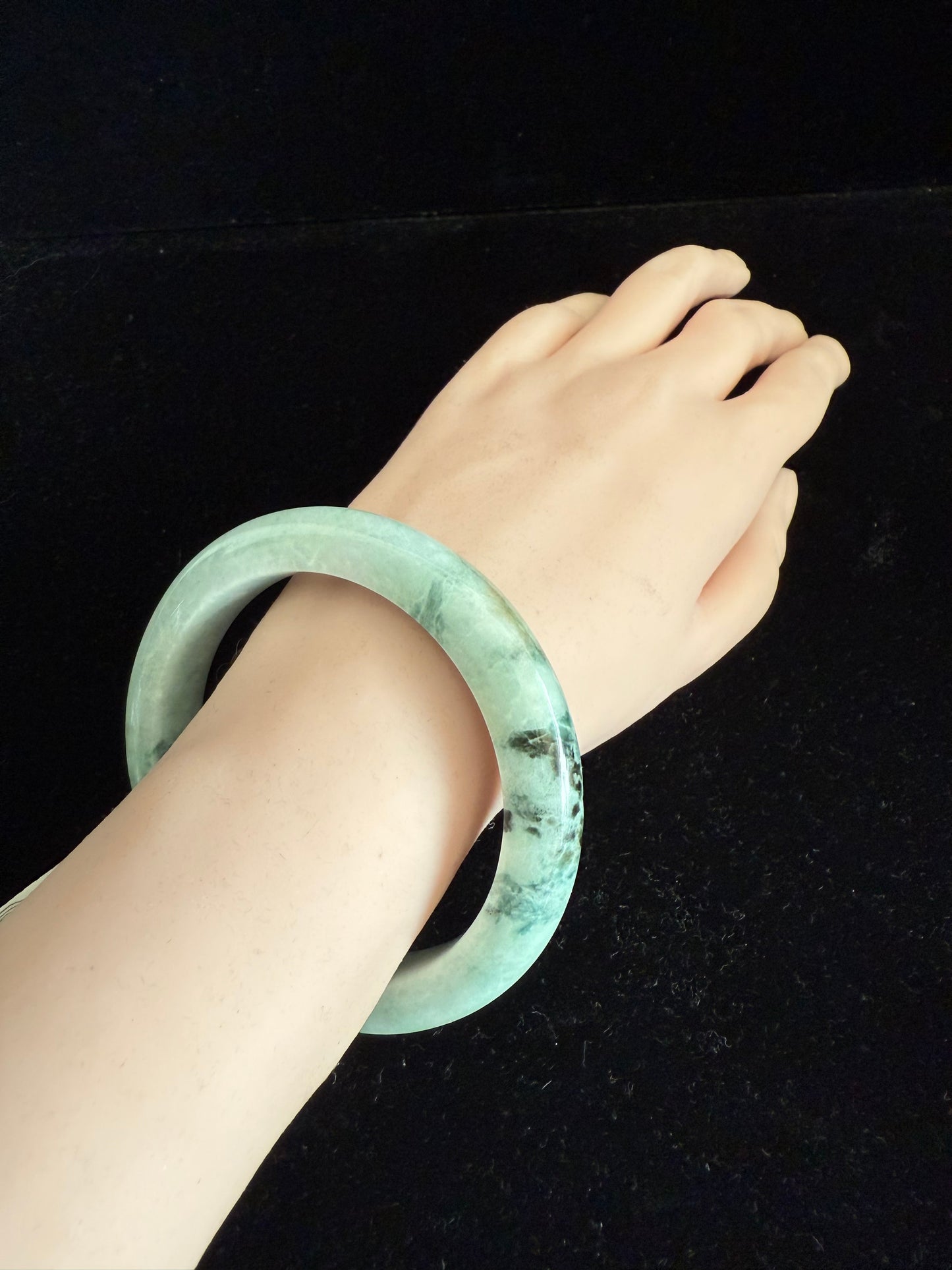 99. Light green with dark brown pattern Jade Bangle.