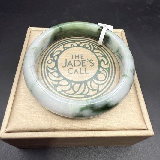 20. White with Touches of Dark Green Jade Bangle