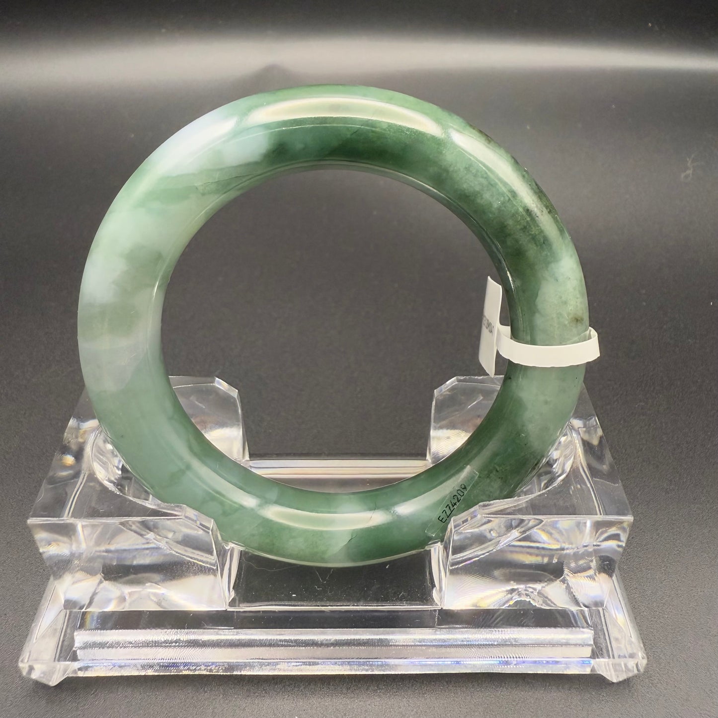 41. Dark green base with white patches jade bangle