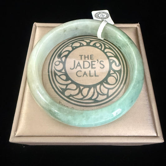78. Intriguing Jade bangle 2 tones of green in half.