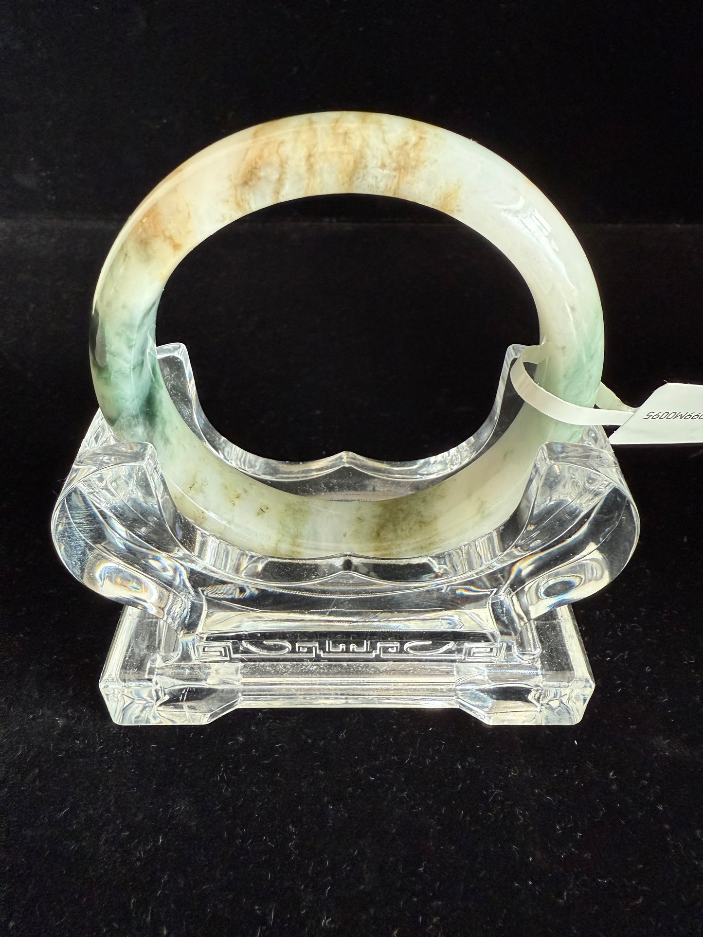 95. Hues of green and yellow brown color jade bangle.
