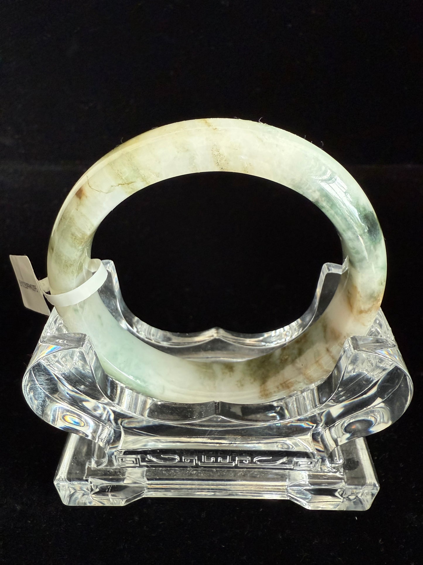 95. Hues of green and yellow brown color jade bangle.