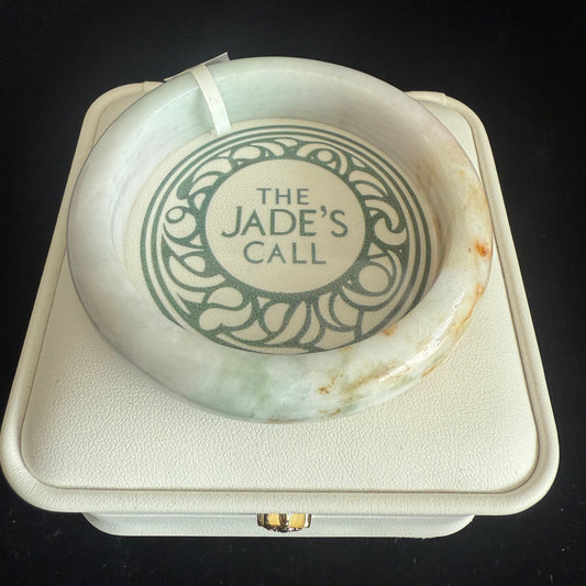 98. Brown, orange touches on white green jade bangle