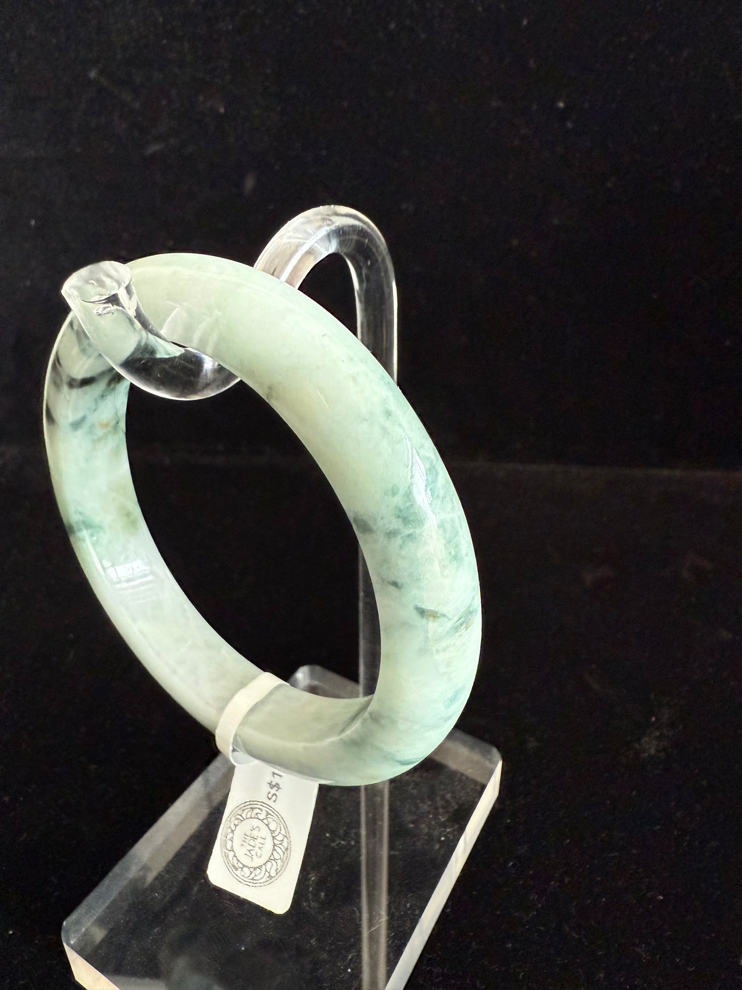 99. Light green with dark brown pattern Jade Bangle.