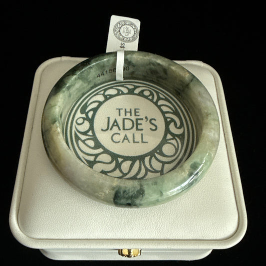 100. Ancient looking yellow green jade bangle