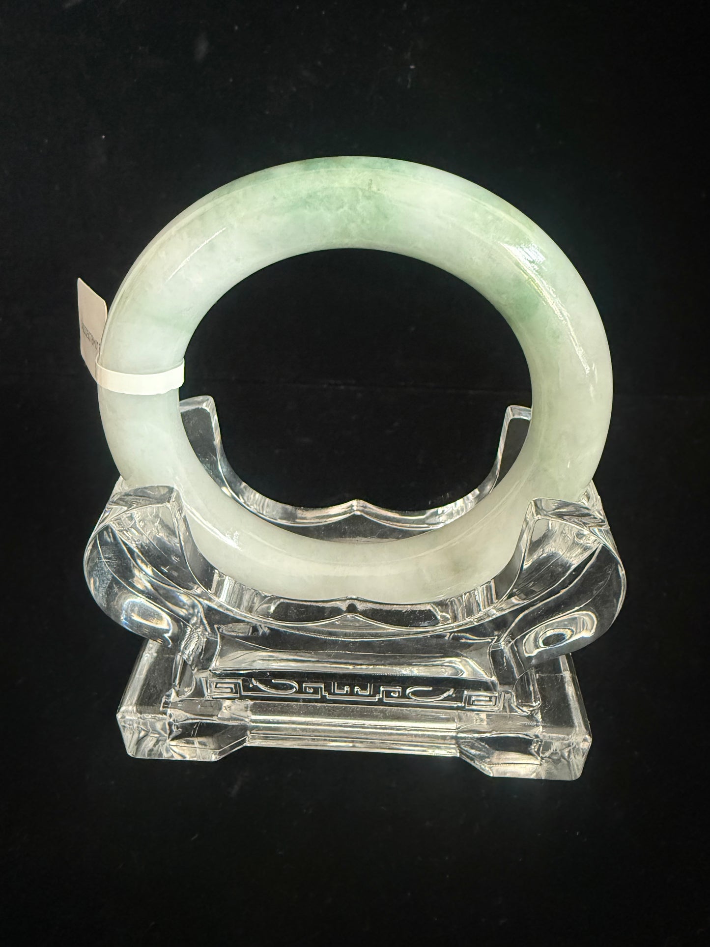 134. Traditional round with swirl of green Jade Bangle