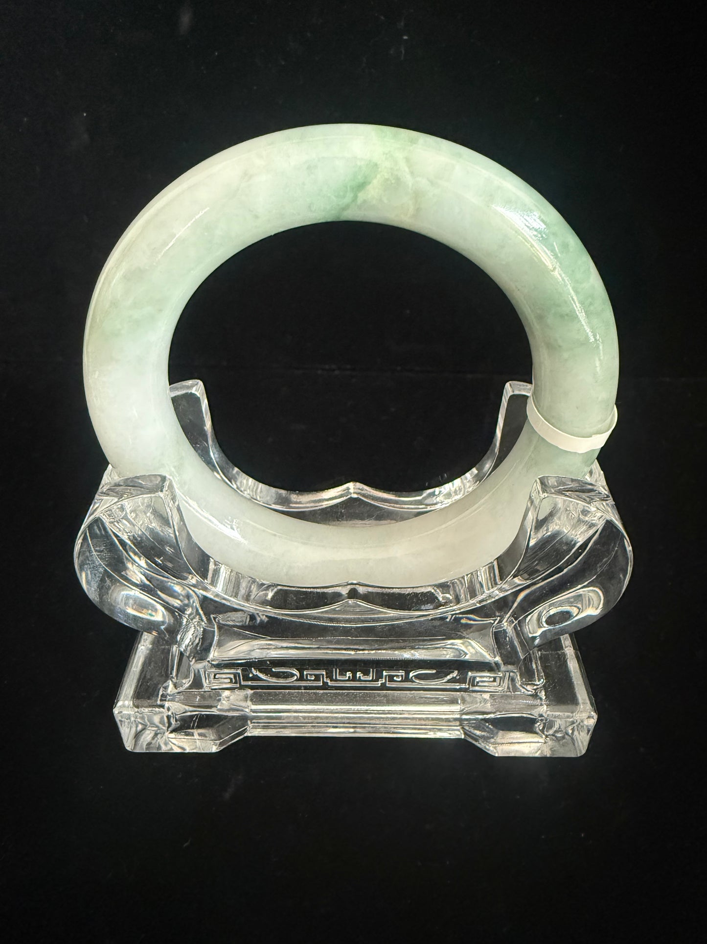 134. Traditional round with swirl of green Jade Bangle