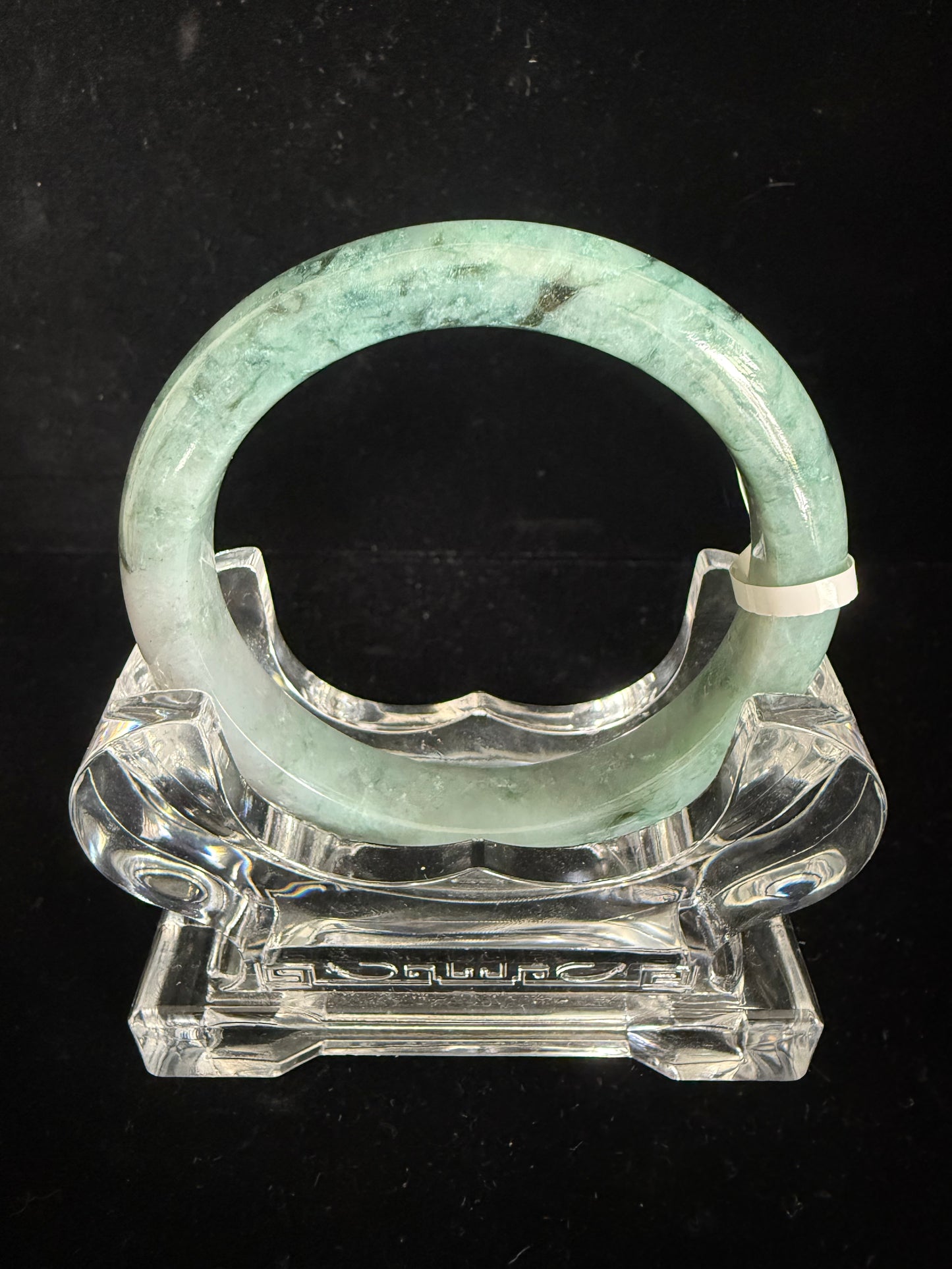 237.  Speckles of dark green and light green blended jade bangle
