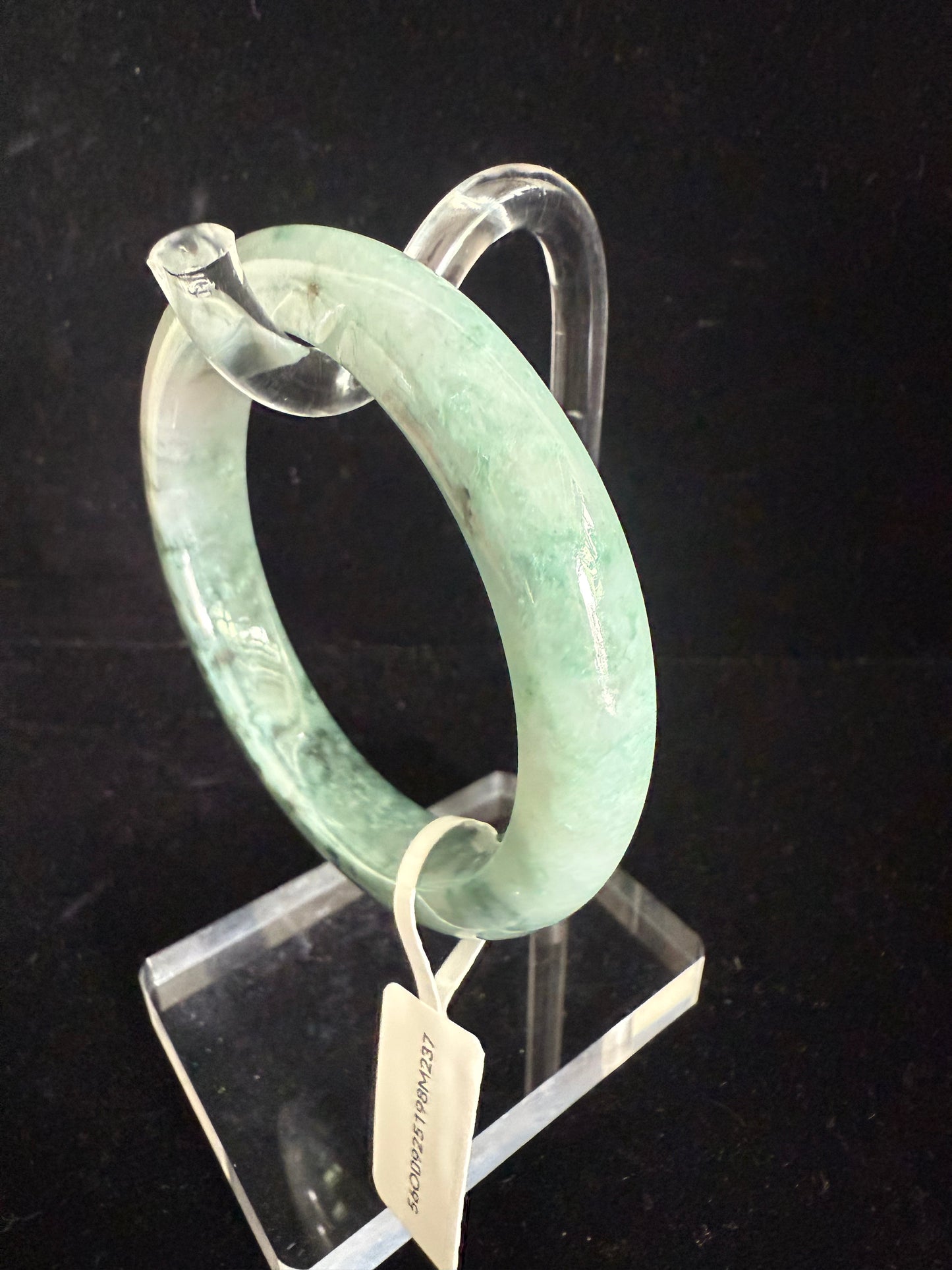 237.  Speckles of dark green and light green blended jade bangle