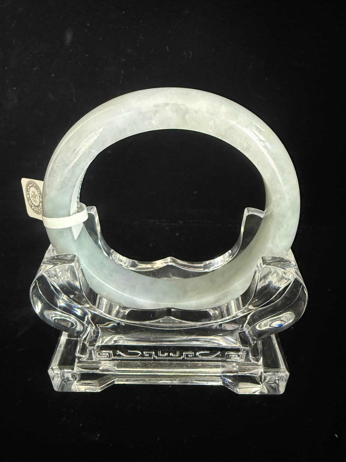 246.  Translucent green and grey Jade bangle