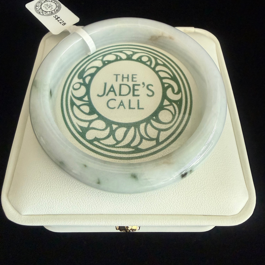350.  Milky white base with traces of dark green Jade bangle