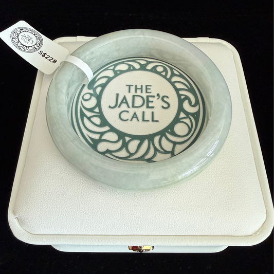 450. Slight yellow tinted Jade Bangle