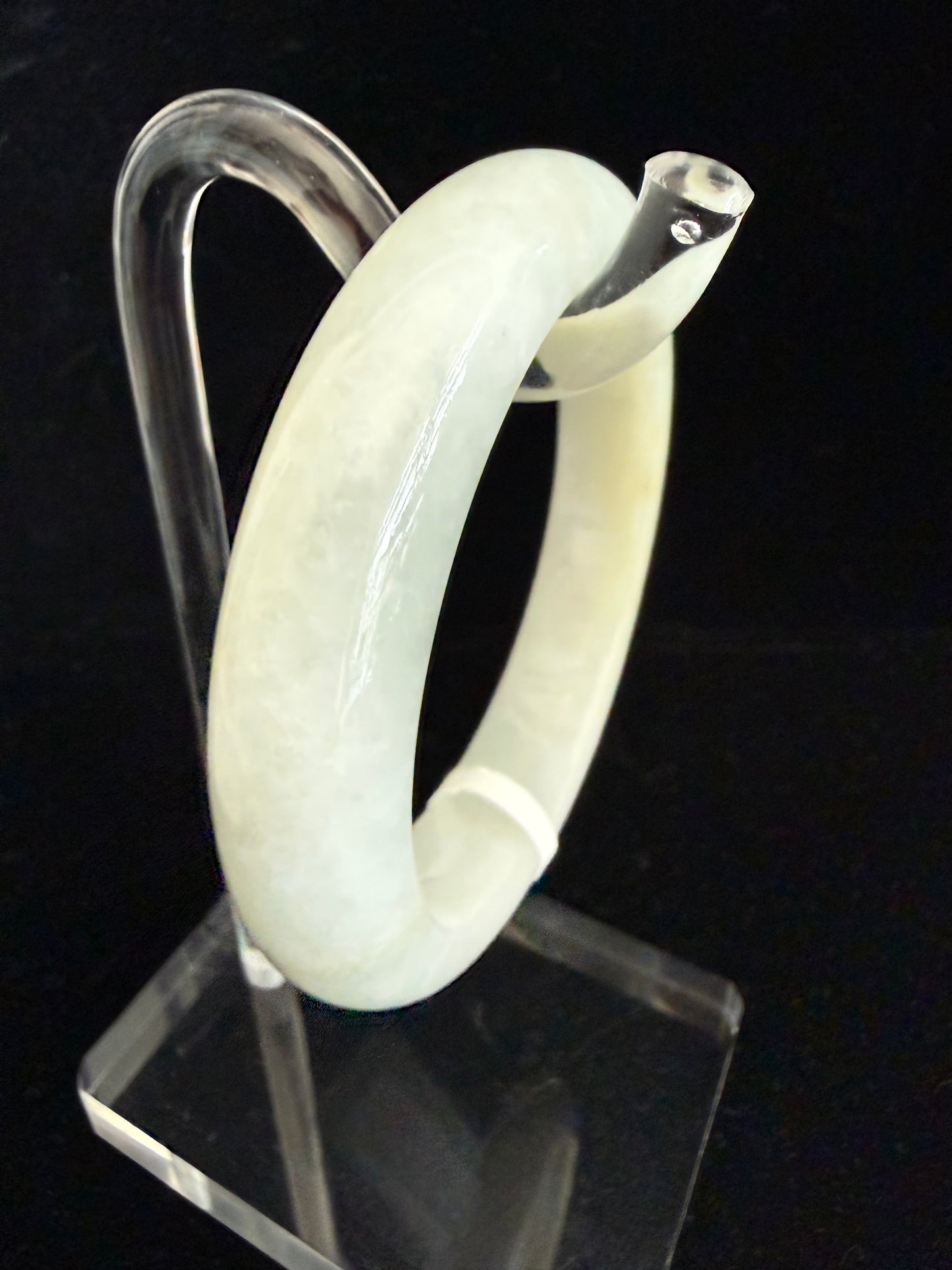 450. Slight yellow tinted Jade Bangle