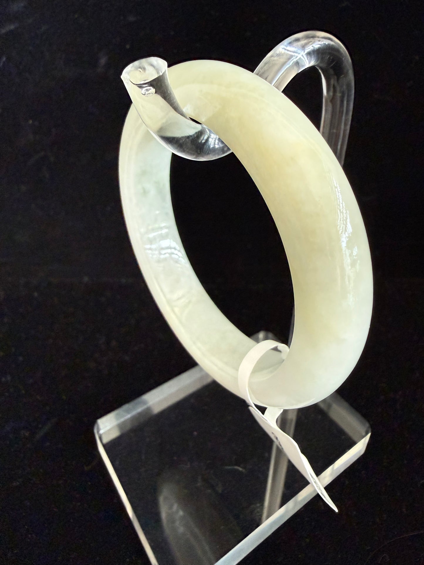 450. Slight yellow tinted Jade Bangle