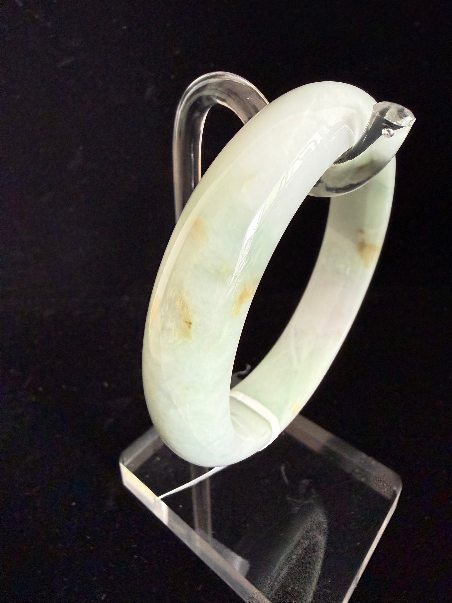 468. Milky pale green with rust spots jade bangle