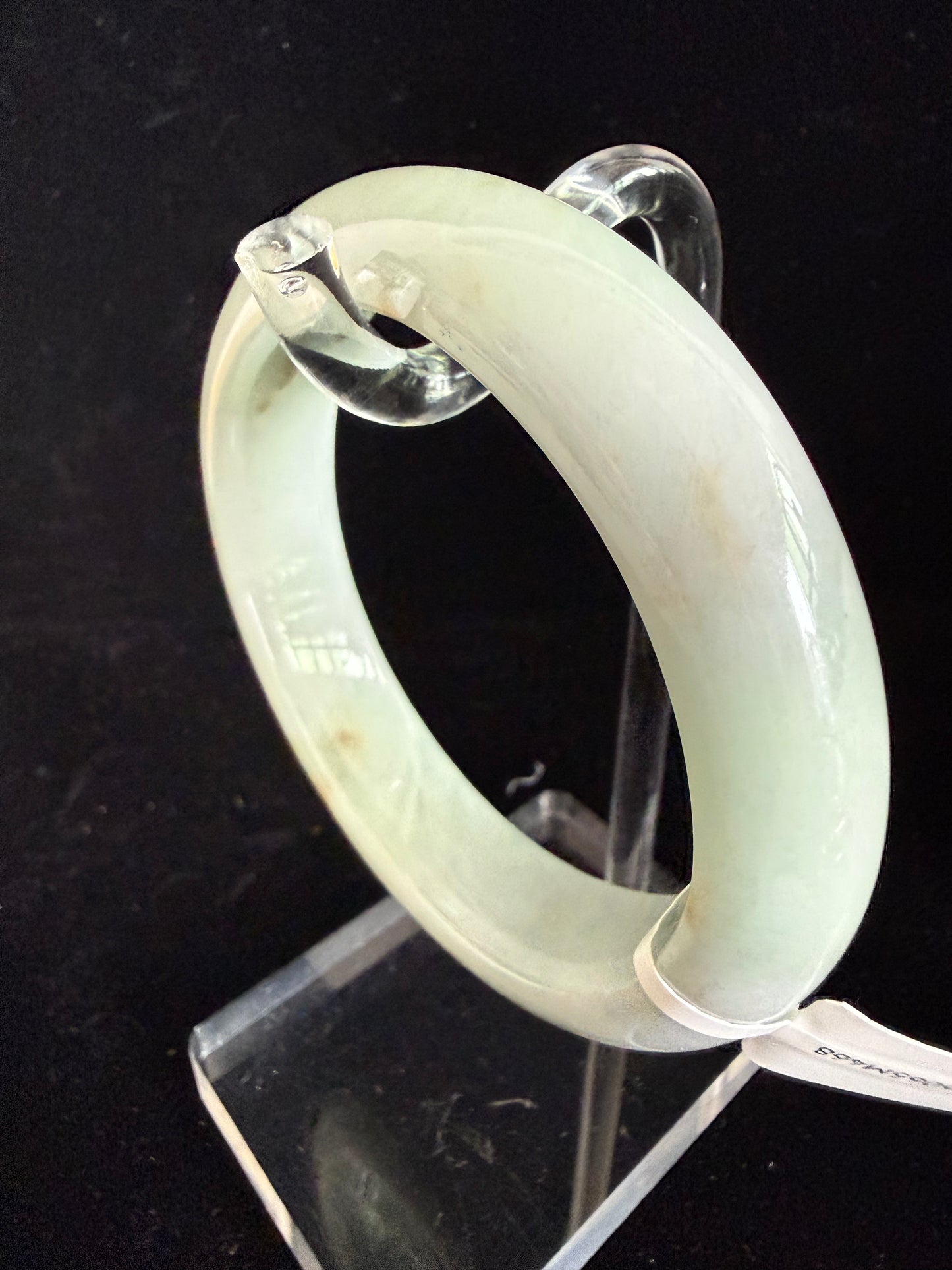 468. Milky pale green with rust spots jade bangle