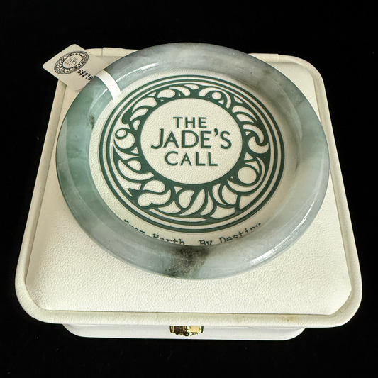 437. Misty green with dark inclusions thin jade bangle
