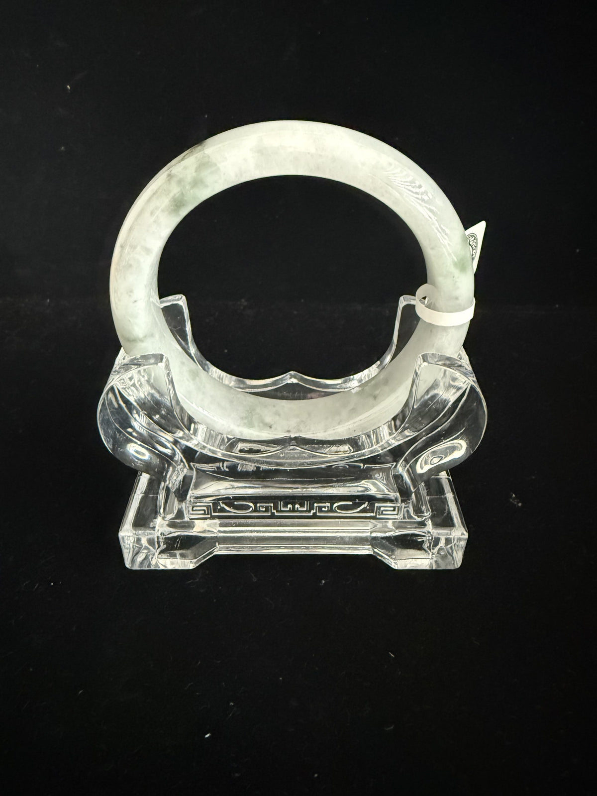 484. White with pale green mottling jade bangle