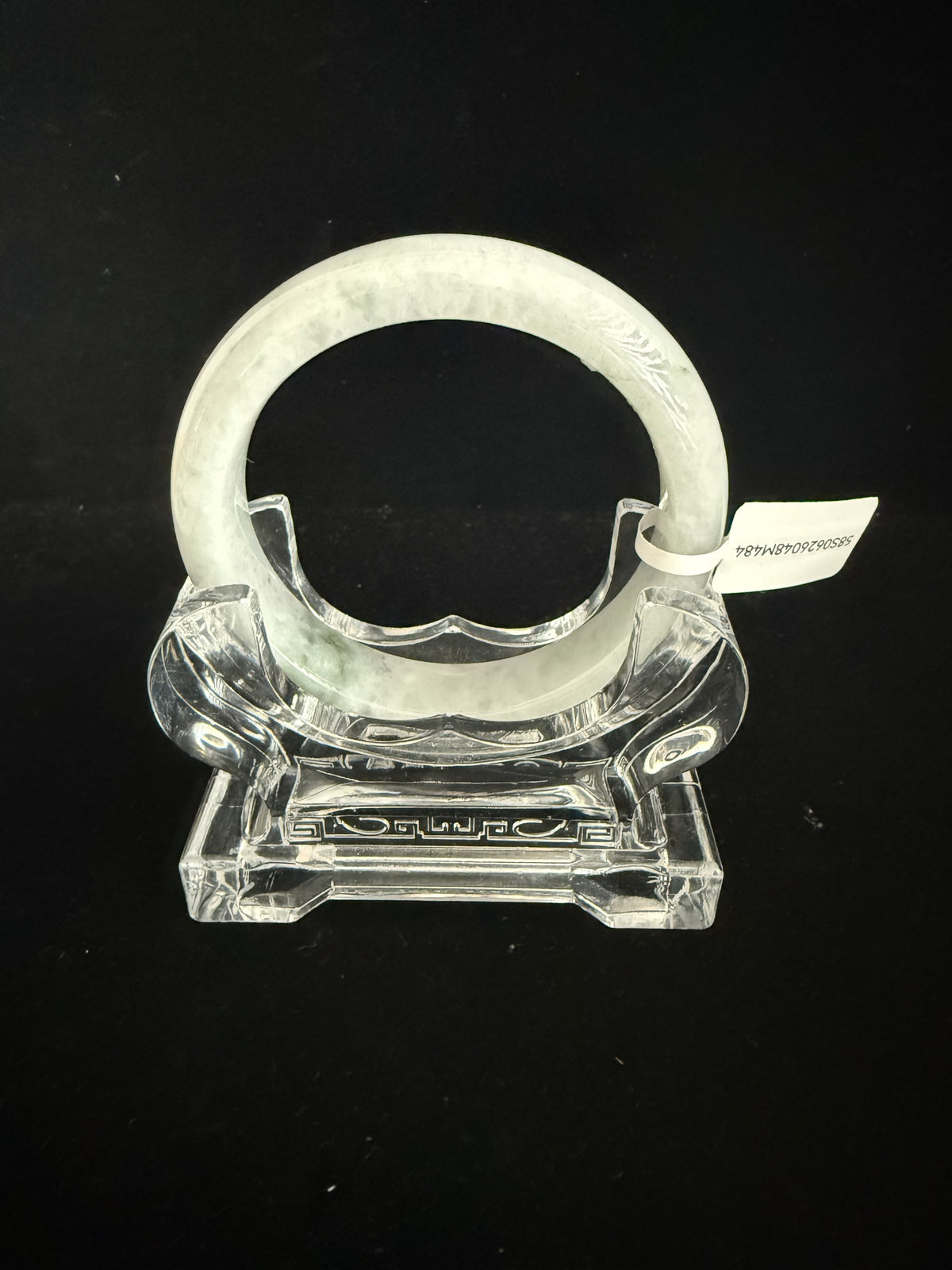 484. White with pale green mottling jade bangle
