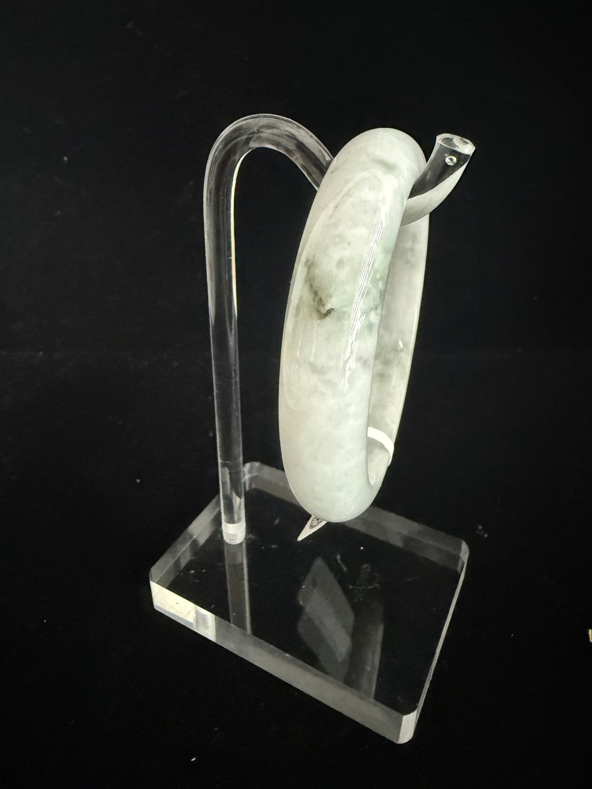 484. White with pale green mottling jade bangle
