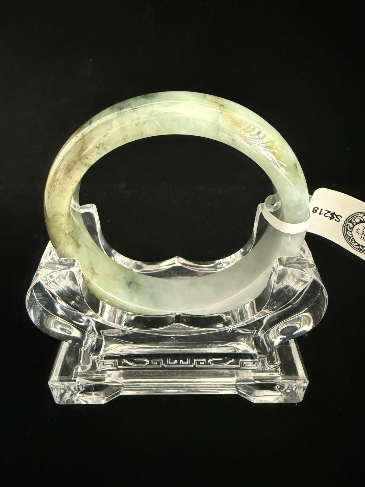479. Green with golden-brown tones jade bangle