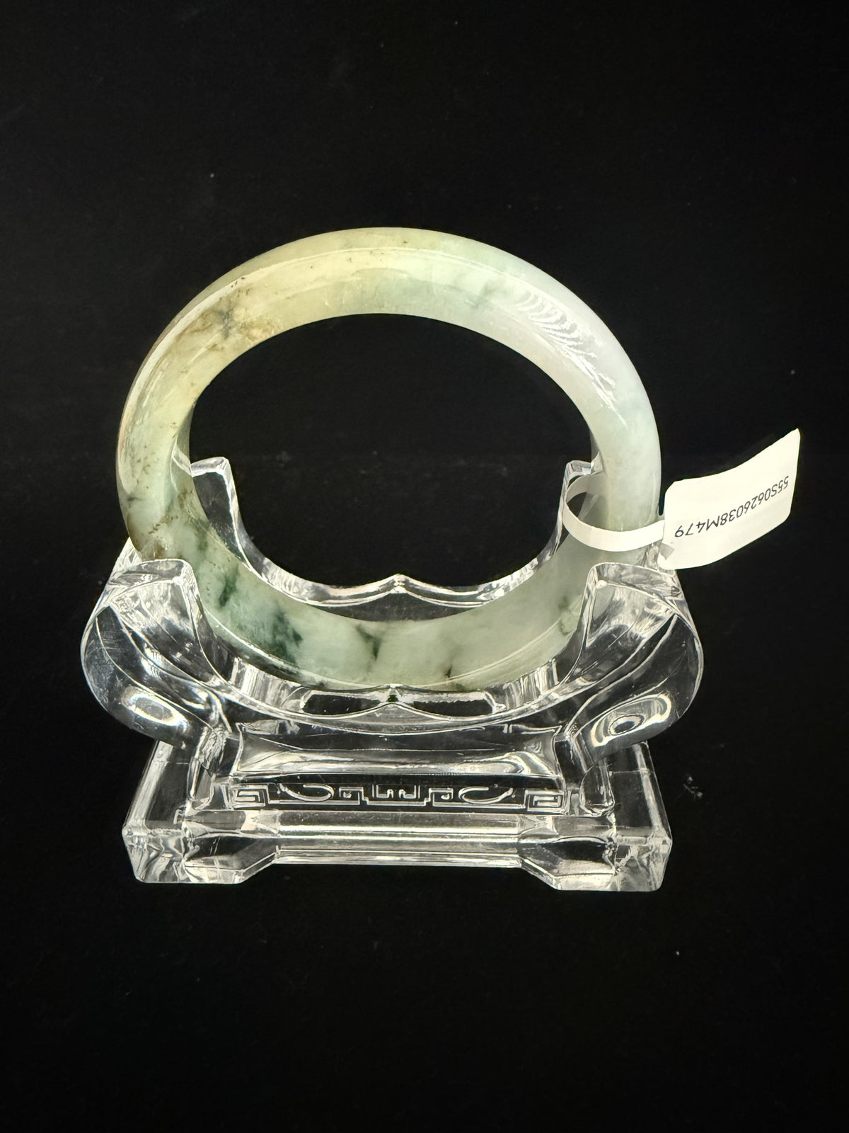 479. Green with golden-brown tones jade bangle