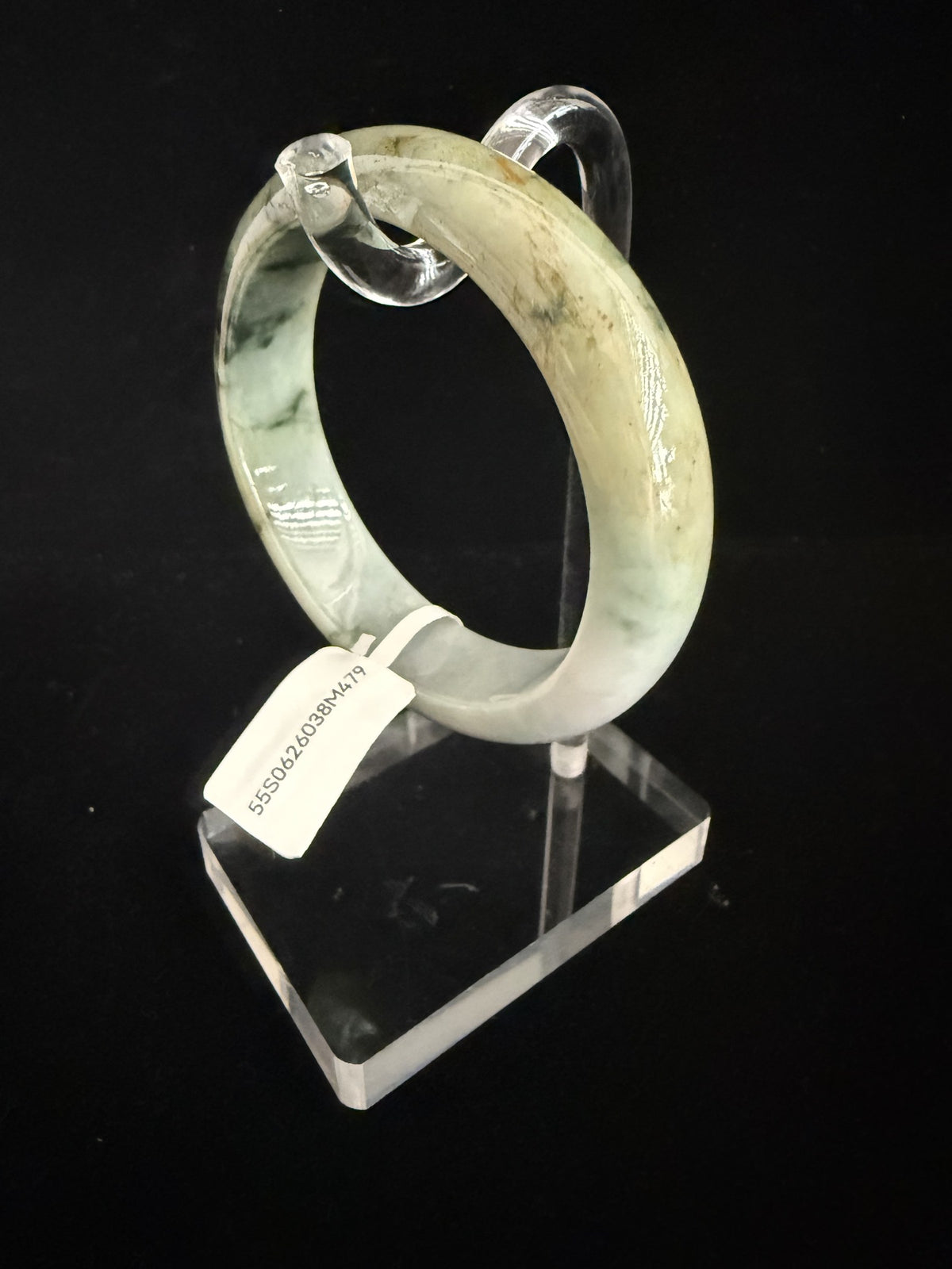 479. Green with golden-brown tones jade bangle