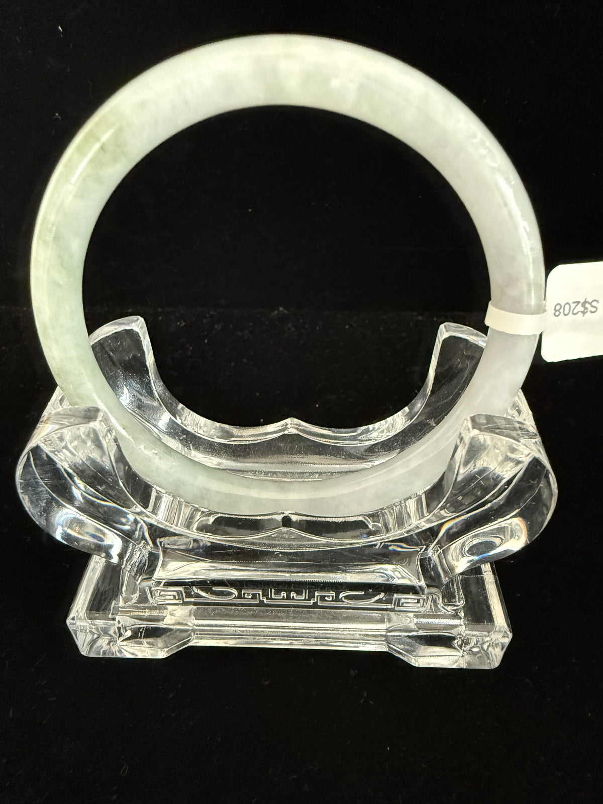 506. Pale celadon with olive mottling thin jade bangle