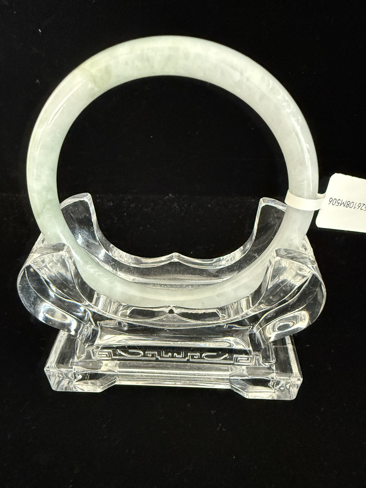 506. Pale celadon with olive mottling thin jade bangle